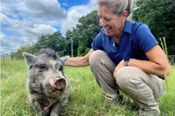 Black Beauty Ranch staff with one of the animal residents