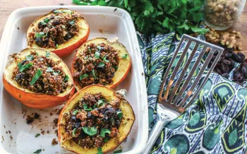 Photo of stuffed acorn squash with herbed quinoa and cranberries