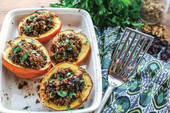 Photo of stuffed acorn squash with herbed quinoa and cranberries