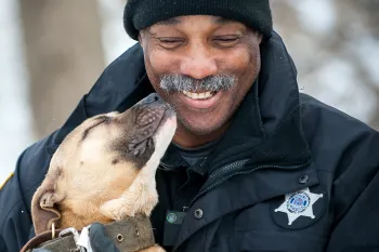 Law enforcement, dogfighting Dog kissing law enforcement