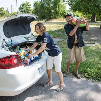 Pets for Life team delivering pet food